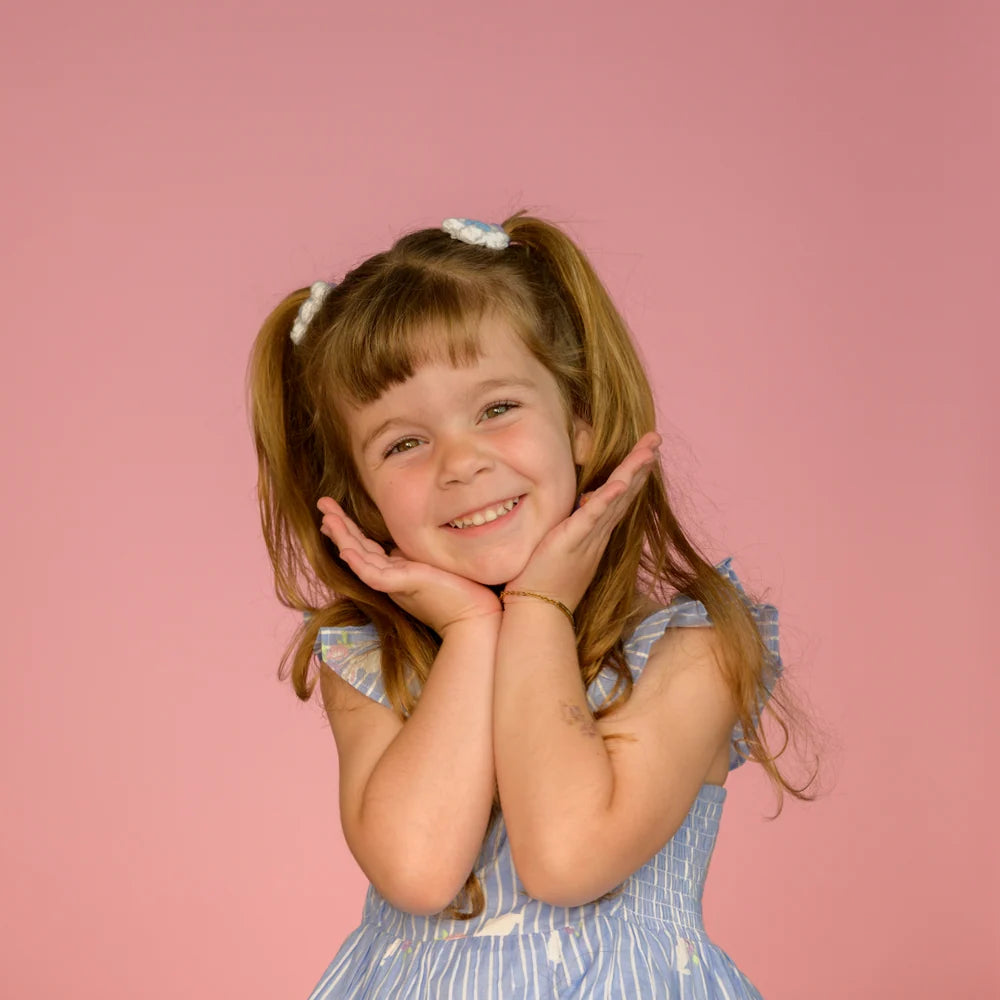 Studio portrait on pink seamless