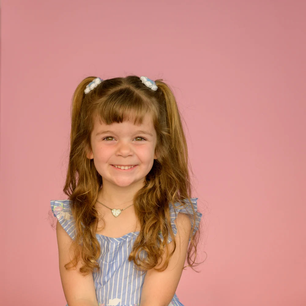 Studio portrait on pink seamless
